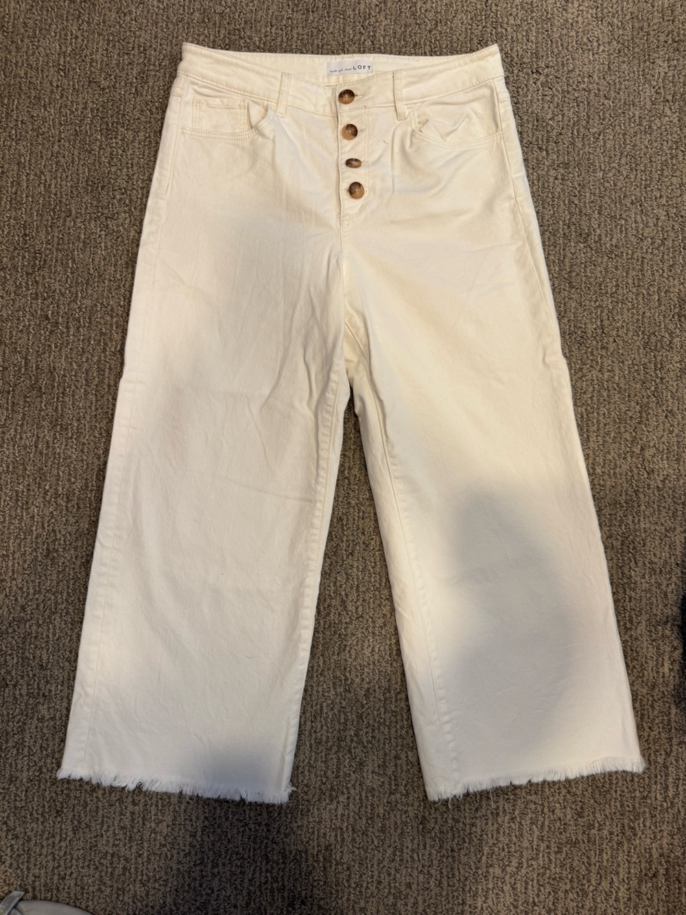 LOFT high waist wide leg cropped jeans with raw hem and button detail